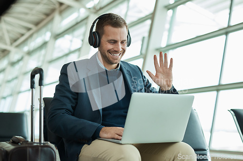 Image of Computer call, wave and business man at an airport in a online meeting ready for work travel. Consulting, businessman and web worker traveling for a job interview talking on a digital conference