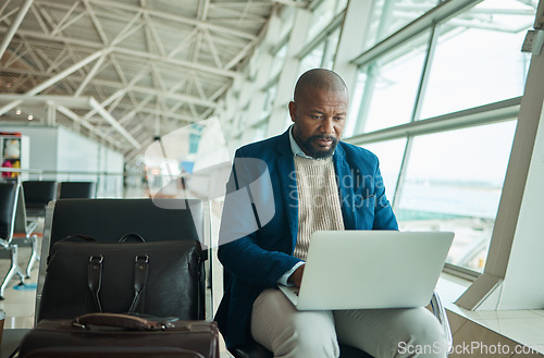 Image of Airport travel, laptop and business man review finance portfolio feedback, stock market database or investment. Online economy, forex account manager and African trader trading NFT, bitcoin or crypto