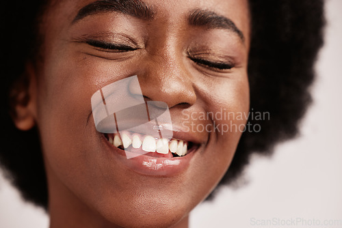 Image of Beauty, face or afro hair and teeth, dental care or mouth hygiene in healthcare, wellness or model grooming. Zoom, smile or happy black woman and skincare glow, clean orthodontics or makeup cosmetics