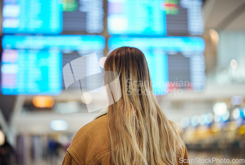Image of Woman, airport and reading board, screen and flight schedule for travel, plane and adventure with back. Girl, immigration and global transportation in lobby for airplane time, departure or arrival