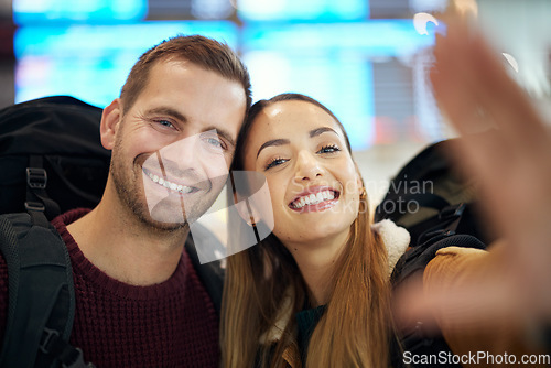 Image of Couple, love and travel selfie at airport lobby taking pictures for holiday, vacation or global traveling. Portrait, flight and man and woman take photo for social media, profile or happy memory.