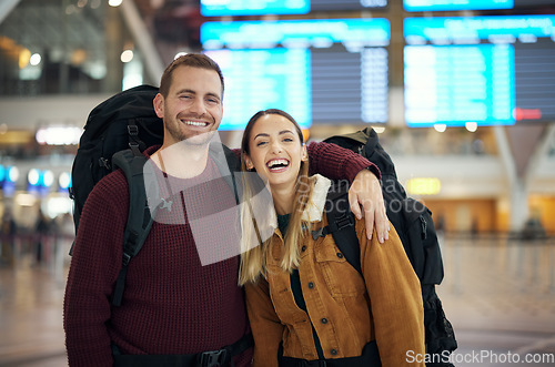 Image of Couple, love and travel portrait at airport lobby for holiday, vacation or global traveling. Luggage, valentines day and happy man and woman laughing at funny joke, hug or waiting for flight together