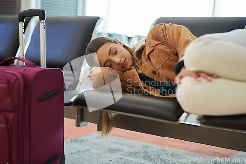 Image of Tired, sleeping and woman at airport, waiting and bench for travel, international transport and flight delay. Tourist nap on chair at airplane lounge before journey with baggage, luggage and suitcase