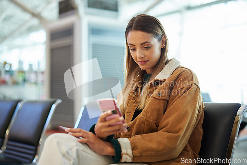 Image of Travel, phone and woman relax at airport lobby on social media, internet browsing or web scrolling. Immigration, mobile technology and female with smartphone for networking while waiting for flight.