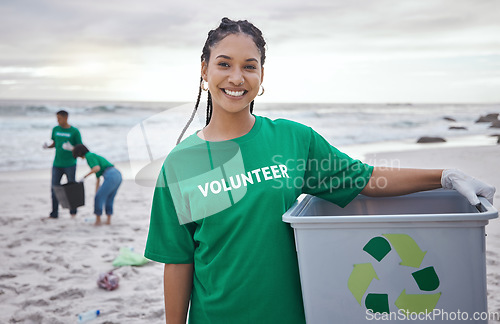 Image of Cleaning, recycle and portrait of black woman at beach for plastic, environment or earth day. Recycling, sustainability and climate change with volunteer and trash for pollution and eco friendly