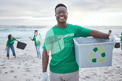 Image of Cleaning, recycle and portrait of black man at beach for plastic, environment or earth day. Recycling, sustainability and climate change with volunteer and trash for pollution and eco friendly