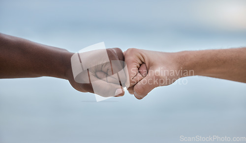 Image of Diversity, hands and fist bump on mockup for community, trust or unity on blurred background. Hand of people bumping fists in solidarity for deal, partnership or teamwork agreement, victory or win