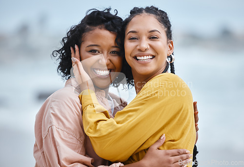 Image of Lesbian, hug and portrait of couple of friends for lgbtq or queer love and freedom on vacation together at the beach. Black woman and partner on a date, fun and excited for valentines holiday by sea