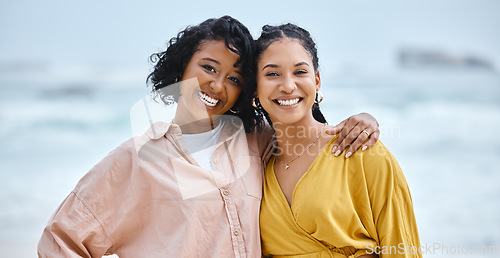 Image of Beach, hug and portrait of couple of friends for lgbtq, lesbian or love and freedom on vacation together with ocean water. Black woman and partner on date, fun and excited for sea, valentines holiday