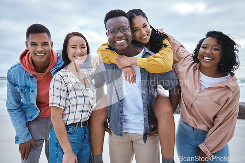 Image of Friends, group and portrait at beach, ocean and outdoor nature for fun, happiness and travel. Diversity of happy young people at sea for holiday, vacation and smile for relaxing weekend trip together