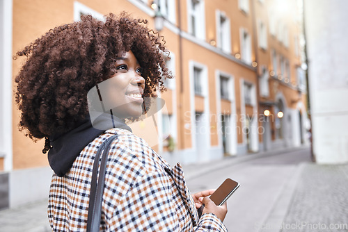 Image of Travel, smile and black woman in street with phone, holiday sightseeing in London, happy tourist walking in road. Vacation, urban adventure and relax, 5g on walk with buildings and explore new city.