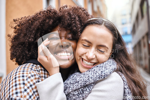 Image of Women, friends and hug on street in city with smile, happiness and solidarity by blurred background. Young african lesbian, happy couple and embrace with love, romance and valentines day adventure