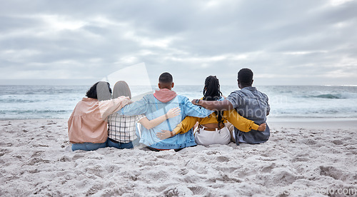 Image of Diversity, hug or friends on beach sand to relax on calm holiday, vacation bonding in nature together. Back view, men and women group relaxing at sea enjoy traveling on ocean trips in Miami, Florida