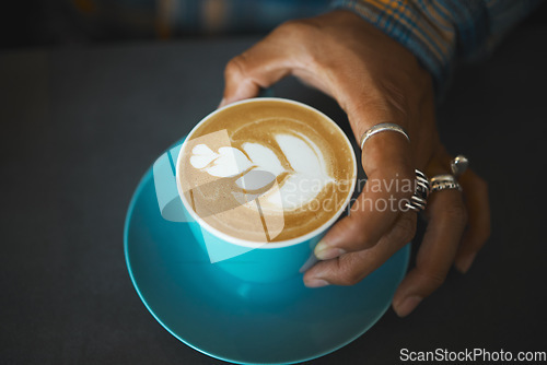 Image of Latte art, coffee and barista hand with leaf design, caffeine and artistic product with pattern in cafe. Creative, man and drawing with milk foam, hospitality with service and beverage closeup