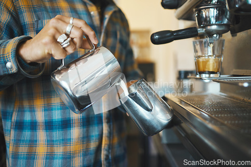 Image of Barista in coffee shop, hands of man and production of latte, working and design with milk foam and espresso. Small business, process and pouring, service and creative with focus and artistic in cafe