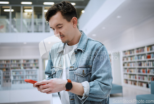 Image of Social media, university or man with phone in library for research, communication or blog news. Bookshelf, education or student on smartphone for scholarship networking, website or online content