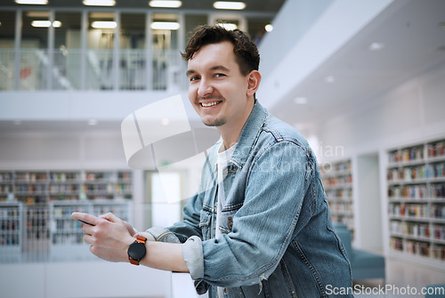 Image of Portrait, university or man with phone in library for research, communication or blog news. Books, education or student smile on smartphone for scholarship networking, social media or online content