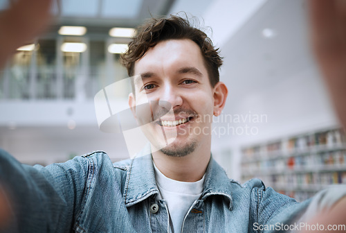 Image of Education, selfie and man in library, smile and cheerful for knowledge, learning and on break. Portrait, male student and academic on campus, casual and happiness for results, achievement and relax