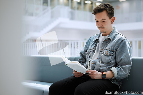 Image of Reading, books and relax man in library for university, college or research focus with philosophy scholarship. Student person of English language, education or knowledge on history studying on campus