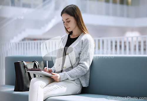 Image of University, student or woman in library with tablet for research, education or learning. Thinking, digital or girl on tech for scholarship study, search or planning school project at collage campus