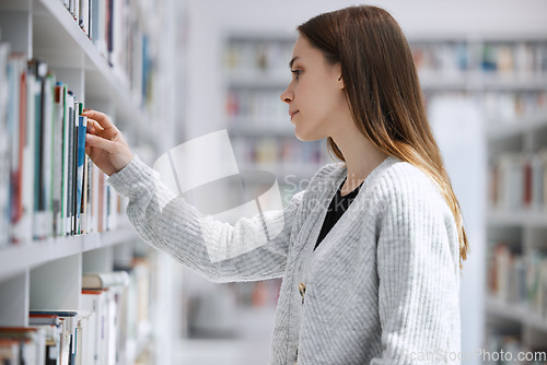 Image of Woman in library, education and student with book search, choice and option with reading and learning at university. Knowledge, story and fiction with textbook, study and browsing bookshelf on campus