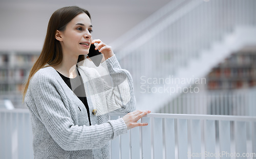 Image of Woman, phone call and communication with technology and connect, virtual conversation with talking. Student at library, speaking on smartphone with contact for research and young person has chat