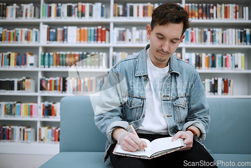 Image of College student man, library and writing on sofa with ideas, vision and focus on education at academy lounge. University, pen and notebook for notes, goals and studying for exam, research and task