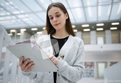 Image of Social media, student or woman with tablet in library for research, education or learning. Networking, focus or girl on tech for scholarship study, search or planning school project at college campus