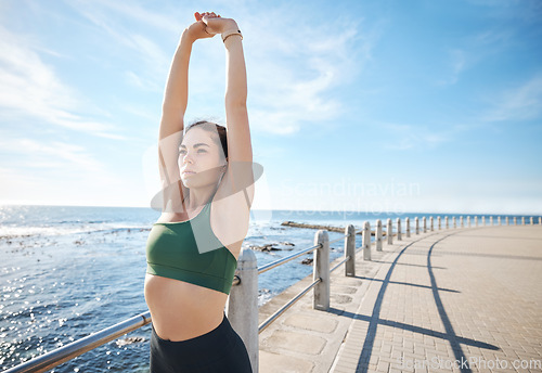 Image of Fitness, beach or sports woman stretching to start running exercise, body training or outdoor workout. Flexible, mindset or healthy girl runner with vision, focus or motivation in warm up in summer