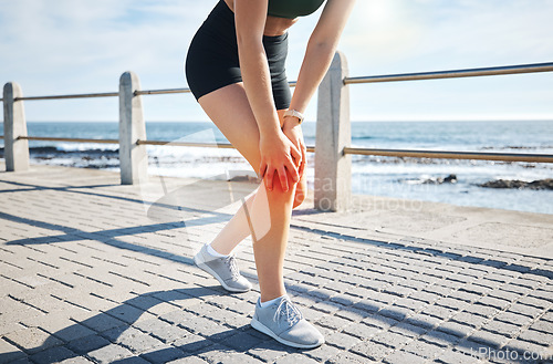 Image of Sports woman, knee pain or red glow by beach fitness, ocean workout or sea training in healthcare wellness crisis. Legs injury, hurt or body stress for runner with burnout on medical anatomy