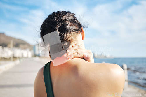 Image of Fitness, beach or sports woman with neck pain after exercising, body training injury or outdoor workout. Red glow, back view or injured girl runner suffering from muscle tendon after running exercise