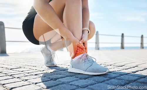 Image of Fitness, hands or runner with ankle pain at a beach after exercising, body training injury or outdoor workout. Red glow, or injured sports athlete suffering from broken foot after running exercise