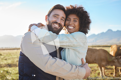 Image of Love, cow and smile with interracial couple on farm for agriculture, peace and growth. Teamwork, animals and hug with portrait of man and black woman in field for sustainability, agro or environment