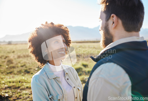 Image of Nature, smile and love with interracial couple on farm for agriculture, peace and growth. Teamwork, bonding and hug with man and black woman in grass field for sustainability, health and environment