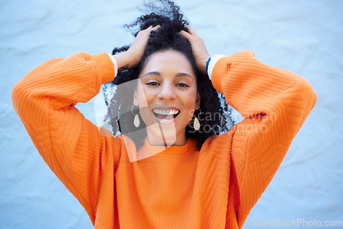 Image of Black woman, portrait or touching fashion hairstyle on isolated blue background, mockup backdrop or wall mock up. Smile, happy or dancing student in trendy, cool or stylish clothes for youth freedom