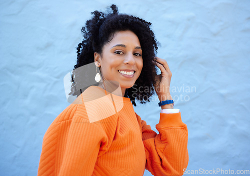 Image of Black woman, portrait or fashion hairstyle on isolated blue background, mockup backdrop or wall mock up. Smile, happy or relax student in trendy, cool or stylish clothes for youth clothing branding