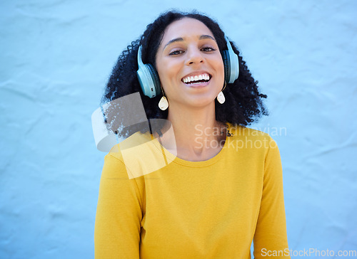 Image of Black woman, portrait or music headphones on isolated blue background, fashion mockup or wall mock up. Smile, happy or laughing student listening to radio, audio and podcast in trendy or cool clothes
