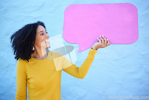 Image of Communication, black woman and speech bubble for advertising, information or mockup on blue studio background. African American female, lady or poster for logo, happy or brand development on backdrop