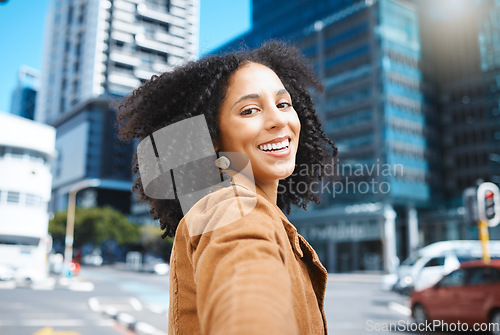 Image of Selfie, urban city and black woman for travel, fashion influencer and outdoor journey in street with natural afro hair. Walking, carbon capture and freedom, happy and young person on road in portrait