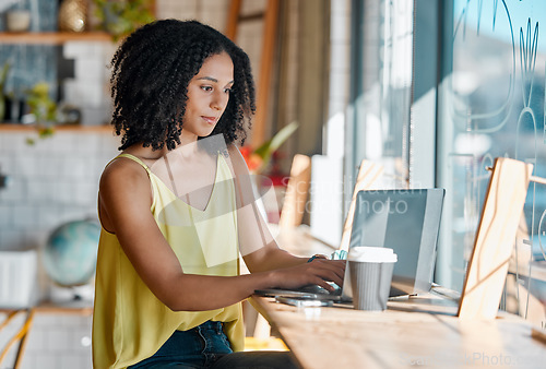 Image of Black woman, cafe and laptop with coffee shop wifi connection while typing email or feedback. Young entrepreneur person doing remote work, social media or writing blog or social media post content