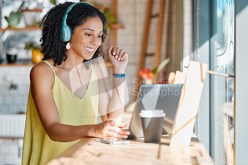 Image of Video call, laptop and business black woman in coffee shop for network, virtual meeting and conference. Communication, cafe and girl with headphones on computer for webinar, freelance and remote work