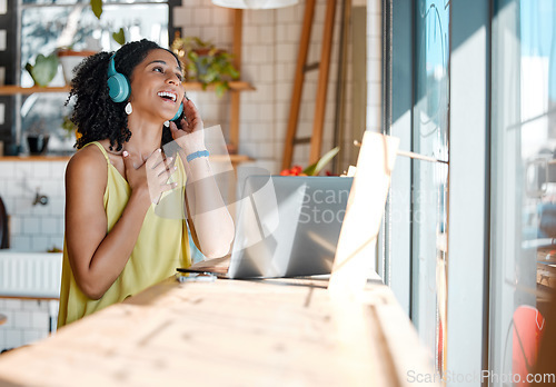 Image of Black woman, music headphones and laptop in cafe for remote work, freelance research or restaurant. Happy female listening to music in coffee shop with computer technology, radio podcast and media