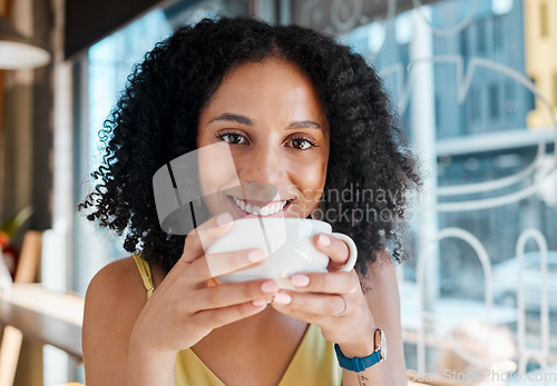 Image of Happy black woman, portrait and relax in coffee shop, restaurant or bistro for lunch, latte and smile. Face, cafe and young female enjoy cup of tea drink, cappuccino and break alone with happiness