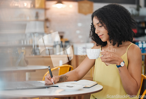 Image of Cafe, freelancer and woman writing notes for a freelance project while drinking a cup of espresso. Technology, notebook and female from Mexico planning business report with a cappucino in coffee shop