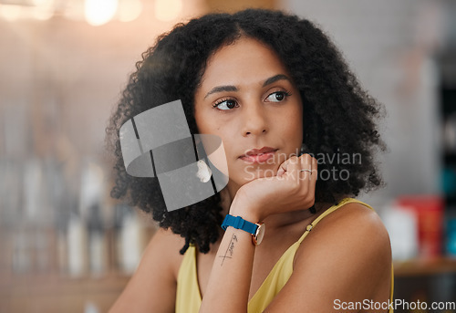 Image of Black woman, face and thinking in cafe for business idea, vision or wondering in thought waiting for service. African American female contemplating in wonder sitting relaxed indoors at a coffee shop