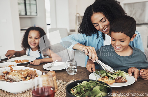 Image of Mom, children and eating food in home together for lunch, dinner table and healthy meal. Happy family, mother and kids smile for dining in house with love, care and happiness of delicious supper
