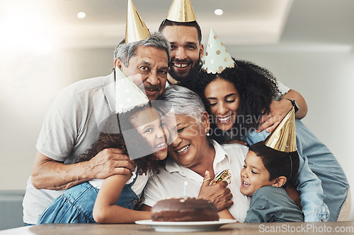 Image of Family, happy birthday and hug portrait of senior woman at a table with a cake, love and care. Smile of children, parents and grandparents together for party to celebrate excited grandma with dessert