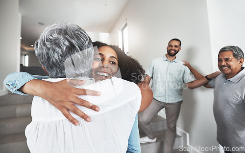 Image of Family, hug or visit with a woman and senior mother hugging in a home together during a reunion. Love, bonding and happy with a mature female hugging her adult daughter while visiting in a home