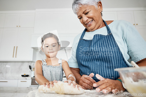 Image of Learning, cooking dough and grandmother with girl in kitchen baking dessert or pastry. Education, family care and happy grandma teaching kid how to bake, bonding and enjoying quality time together.