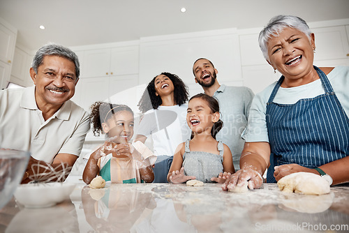 Image of Cooking, learning and big family with kids in kitchen baking with dough and laughing at comic joke. Education portrait, care and mother, father and grandparents teaching girls or sisters how to bake.